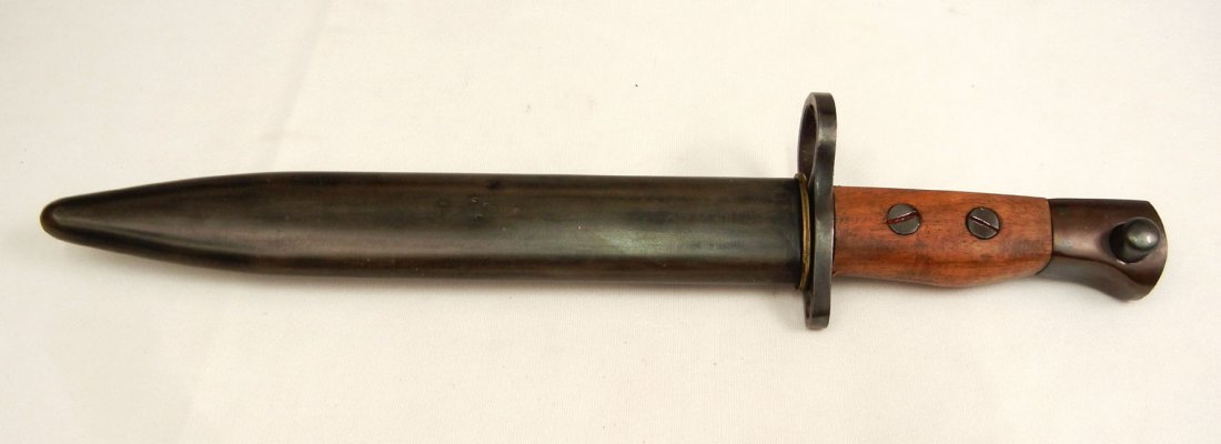 R.F.I. Jungle Carbine bayonet in scabbard: R.F.I. Jungle Carbine bayonet in scabbard, marked on ricasso R.F.I, blade is 8" long, overall 12 3/4" long