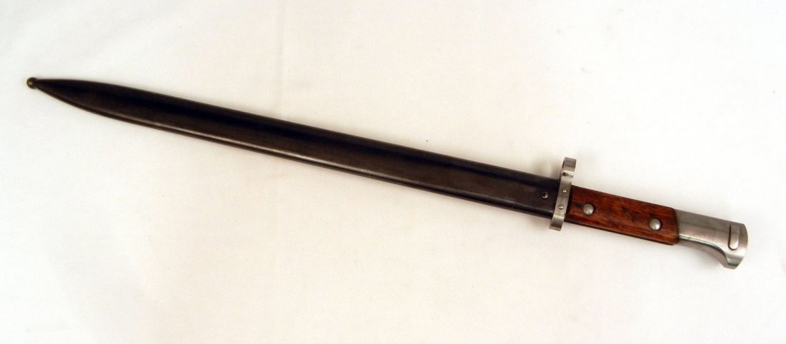 Persian Mauser bayonet in scabbard: Persian Mauser bayonet in scabbard, pommel has maker's mark, blade 15 3/4" long, overall 21 1/2" long