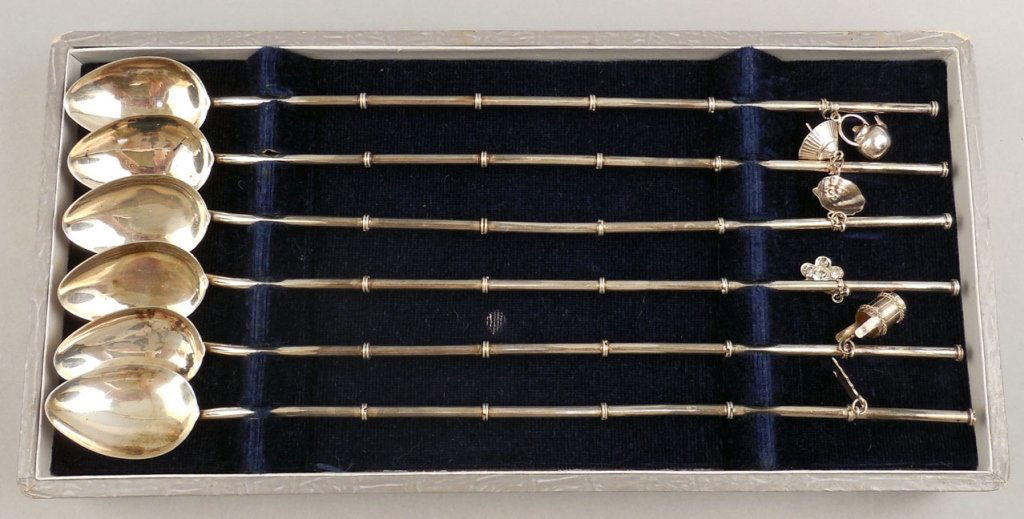 Set of six sterling silver ice tea spoons: Set of six sterling silver ice tea spoons, each with unique hanging charm, in velvet lined case, 9", 2.005 troy ounces