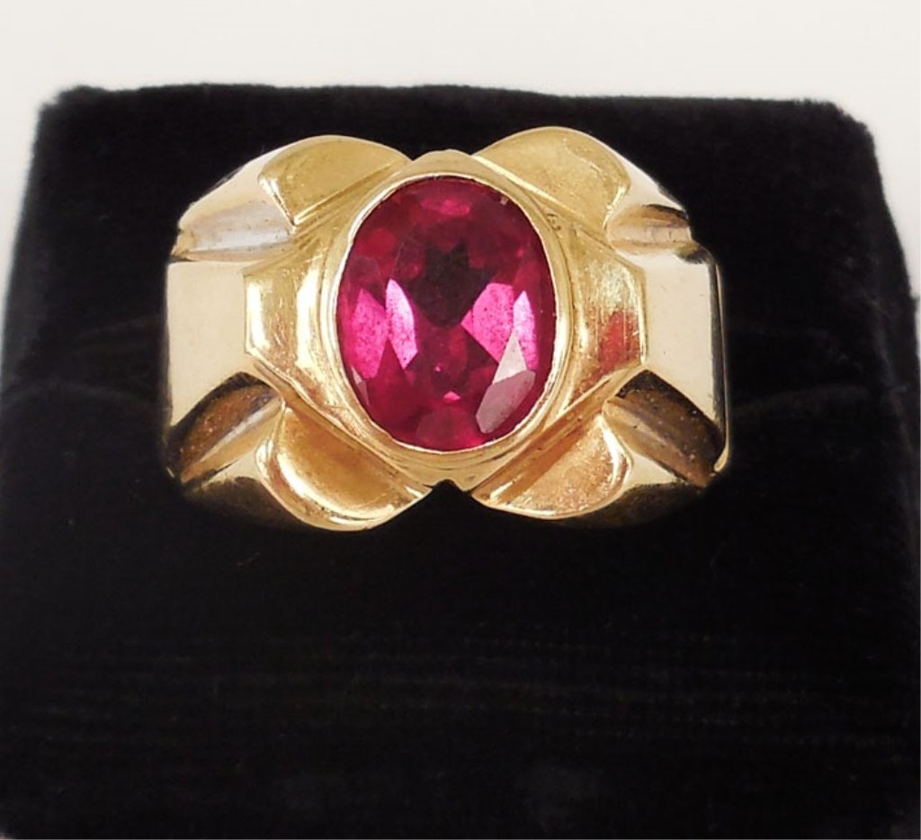 Man's gold ring with red stone: Man's retro 14k gold ring with synthetic red spinel, ring is 1/2" long at center, size 12 1/2, weight 8.2 grams/5.3 dwt, ca. 1950