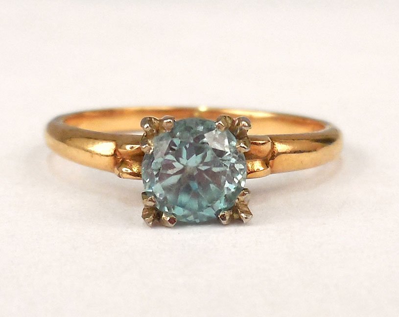 Gold blue zircon ring: 14k gold blue zircon ring, one round faceted blue zircon measuring 5mm in diameter, size 6 1/2, stamped 14k, weight 2.5 grams/1.6 dwt, ca. 1930