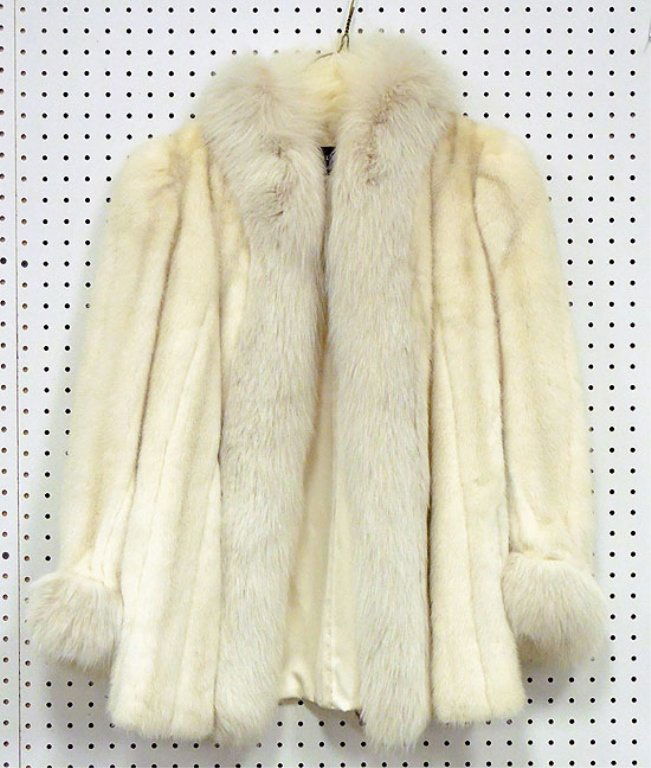 White mink jacket: White mink jacket with white fox collar and cuffs, 30" long from collar to hem, 25" long from shoulder to cuff, size small, cream color sating lining, Saks Fifth Avenue label, made by Revillon, Paris,