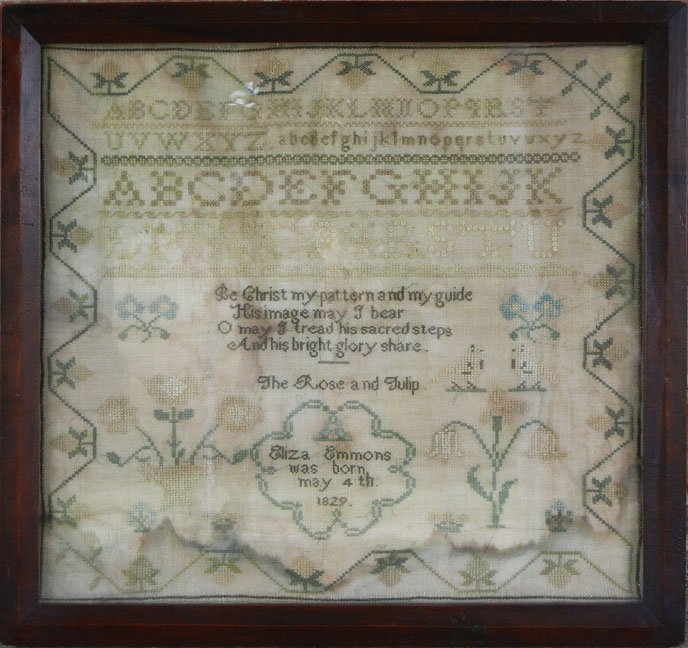 Needlework sampler, Eliza Emmons: Needlework sampler, Eliza Emmons, with alphabet, verse, flowers and border, "Eliza Emmons was born May 4th 1829", in walnut frame