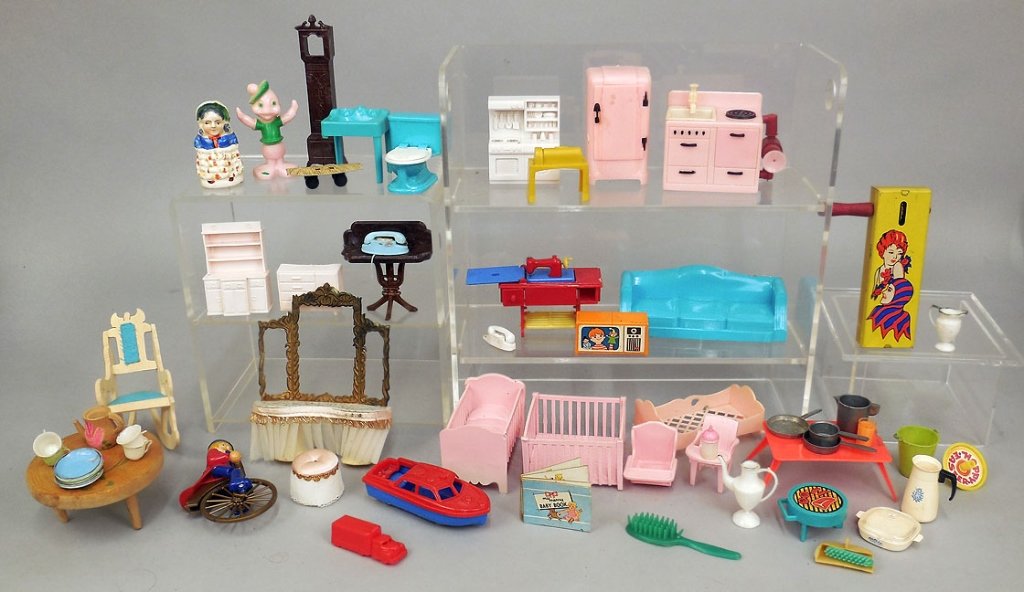 Small grouping of doll furniture: Small grouping of plastic doll furniture, including Marx baby room set, Made in Hong Kong kitchen set, Renwal sewing machine, Ideal vanity set, wooden table marked Japan, wooden chair marked Mexico, t