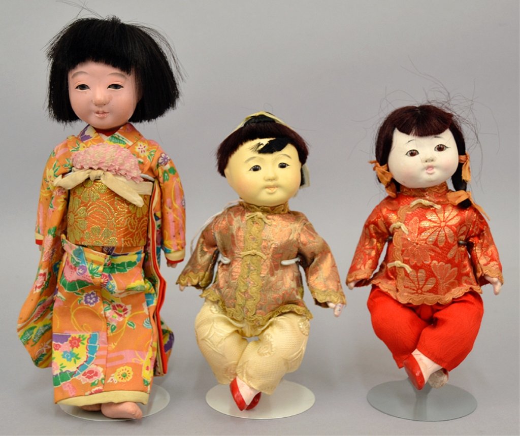 Three Oriental dolls: Three Oriental dolls, bisque type dolls, mother and two children, 10" and 7 1/2", unmarked, in kimonos, unmarked