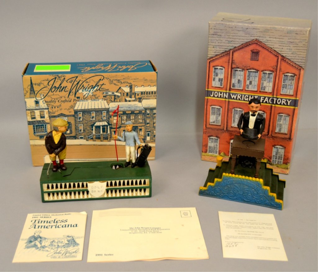 Two cast iron John Wright mechanical banks: Two cast iron John Wright mechanical banks, including Magician Bank, Limited Edition 1990 Series 73 250, with COA, in original box, bank measures 8" x 6 3/4" x 3 3/4", and Golf Bank in original box, 2