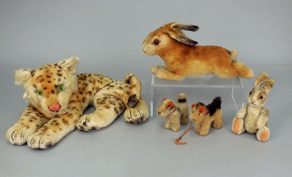 Steiff vintage animals: Steiff vintage animals, including Steiff leopard, with green glass eyes, button in ear, 7" high, rabbit, with button and tag in ear, 1317,0, tag on arm Made in US Zone Germany, 5" high, seated rabbit 