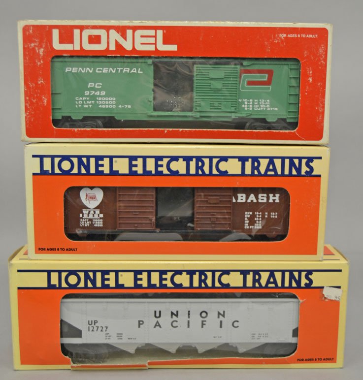 Three freight cars in boxes,: Three freight cars in boxes, includes Lionel No. 16255 Wabash Double Door Boxcar, Lionel No. 9749 Penn Central Box Car, and MTH Union Pacific hopper in a Lionel box