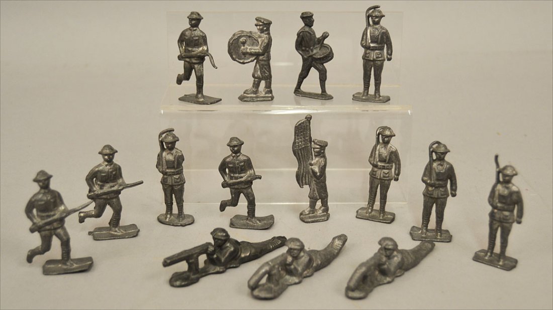 Fifteen lead toy soldiers,: Fifteen lead toy soldiers, one carrying flag, two with drum, unmarked, 3 1/8" and smaller