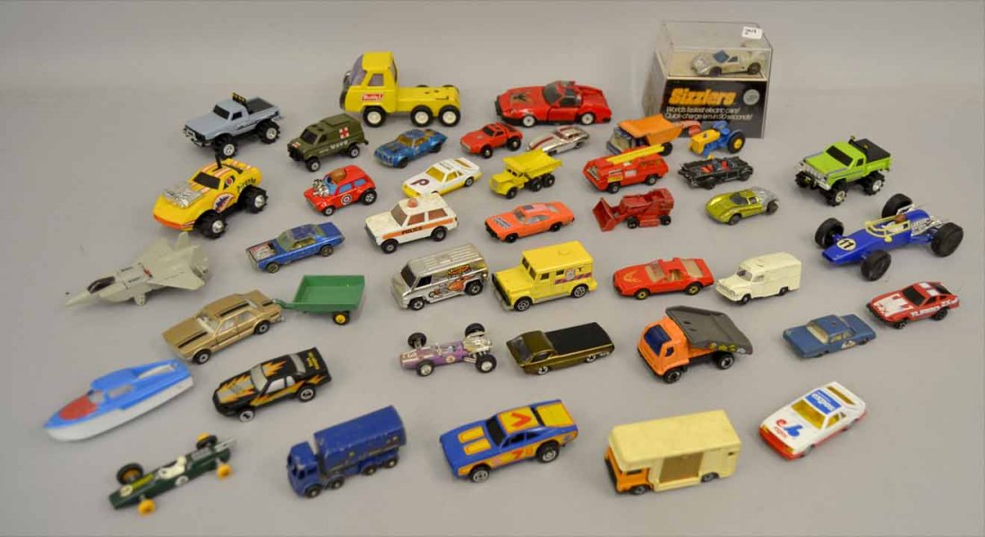 Grouping of Hot Wheels cars, Corgi, Matchbox by Lesney,: Grouping of Hot Wheels cars, Corgi, Matchbox by Lesney, Tonka, Dyna-Mite, Aurora, KidCo, Bandai, Schaper Mfg., Popy Japan, Sizzlers Hot Wheels in original case, and more, approximately fifty-one cars,