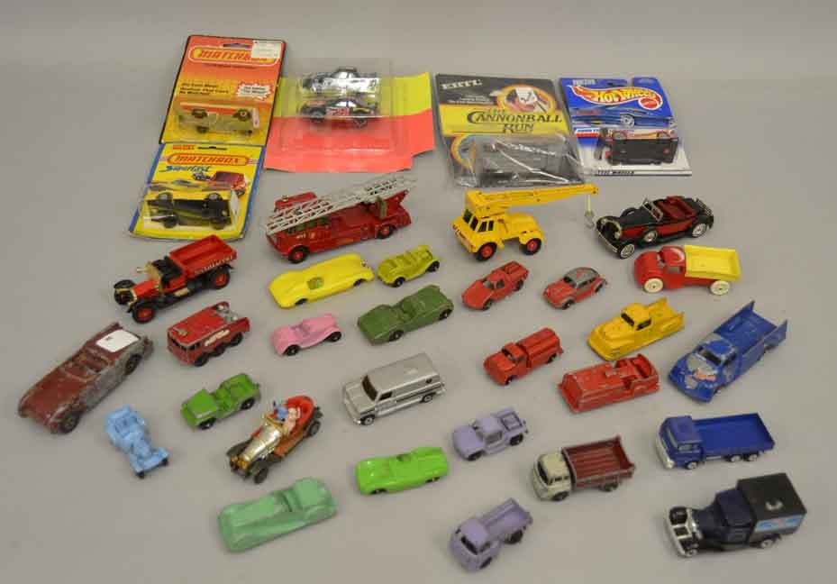 Grouping of toy cars, including Toostietoy, Midgetoy,: Grouping of toy cars, including Toostietoy, Midgetoy, "Matchbox" by Lesney Merry Weather Fire Engine and Taylor Jumbo Crane, Models of Yesteryear, six still in packages, Ertl The Cannonball Run, Match
