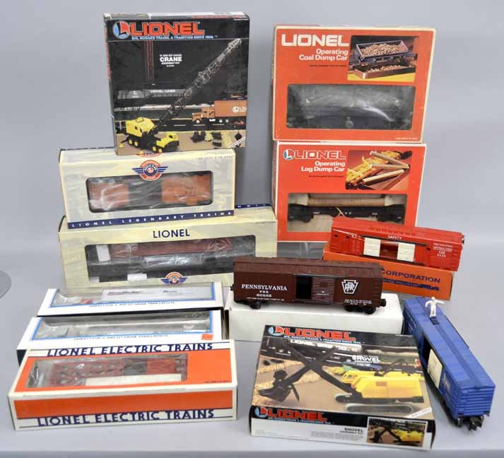 Twelve Lionel postwar boxed O and 027 gauge freight car: Twelve Lionel postwar boxed O and 027 gauge freight cars, includes No. 6-9304 Operating Coal Dump Car, No. 6-16604 Operating Log Dump Car, No. 6-19801 Poultry Dispatch Car, No. 6-39424 PWC 6418 US Ste