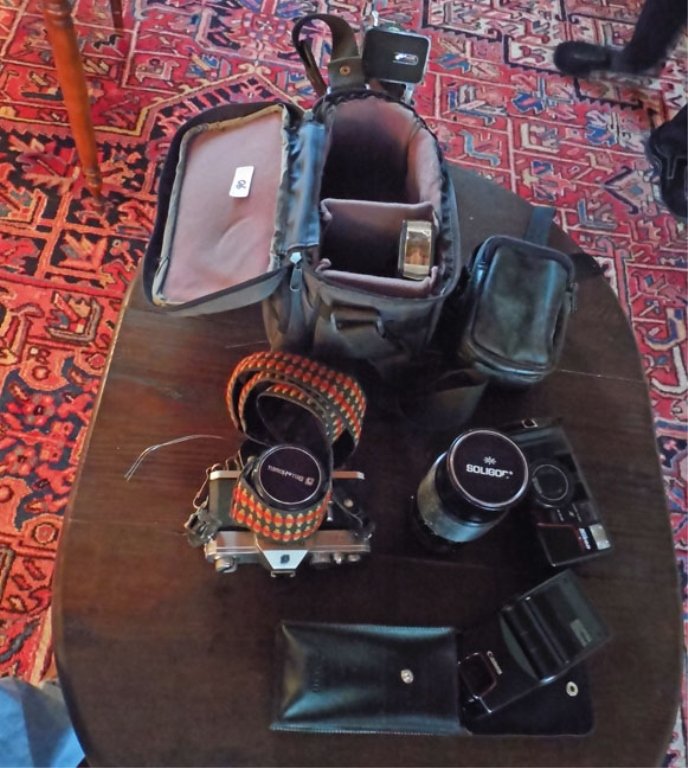 Cameras and equipment: Bell & Howell 35mm camera, Nikon 35mm camera, Soligor 200 mm lens, camera bags, flash and tripod