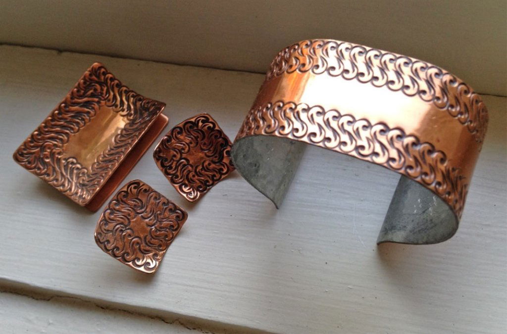 Gret Barkin hand wrought copper four piece jewelry: Gret Barkin hand wrought copper four piece jewelry suite, including brooch 1 1/2" x 1", cuff bracelet 2" x 2", and pair of screwback earrings 3/4" square