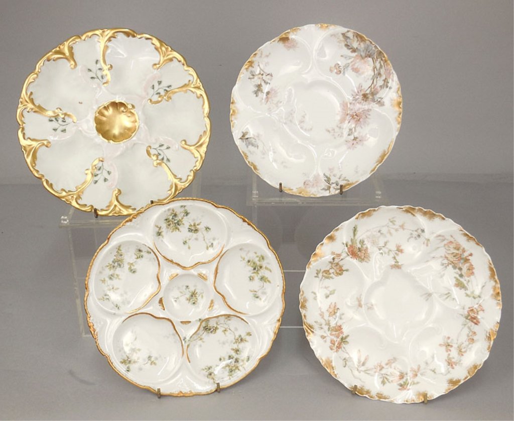 Four Limoges oyster plates: Four Limoges porcelain oyster plates, floral with gilt edges, each with five wells, includes two by Haviland & Co., 7 3/4" and 8 3/8" diameter, one by Theodore Haviland, 8 3/8" diameter, and one by El