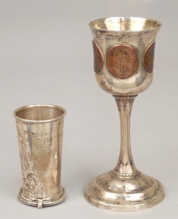 Morgan Smith shot glass and a Swedish sterling chalice: Morgan Smith sterling shot glass mounted on a 1921 Morgan silver dollar, "Dixie Sky" engraved on side of cup, hallmarked Morgan Smith, 2 3/4", and a Swedish sterling chalice, foreign coins around bowl