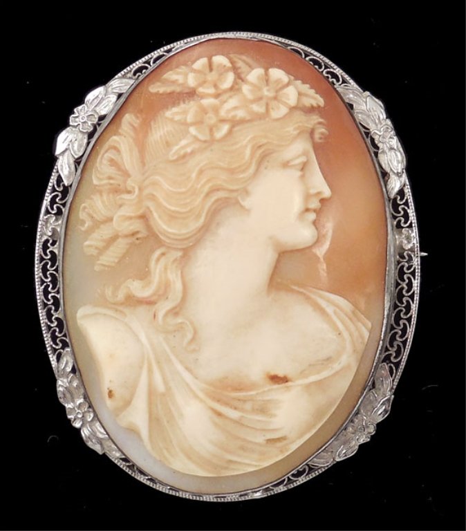 Edwardian cameo brooch: Carved shell cameo brooch in rhodium plated filigree frame, 2 1/8" long x 1 3/4" wide, unmarked, ca. 1910