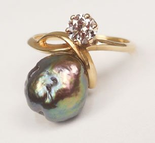Tahitian pearl & diamond ring: 14k gold pearl and diamond ring, one 10mm (irregular) black Tahitian pearl and one round diamond measuring approximately 0.25 carats, front of ring measures 3/4" long at center, size 8 1/2, stamped 14