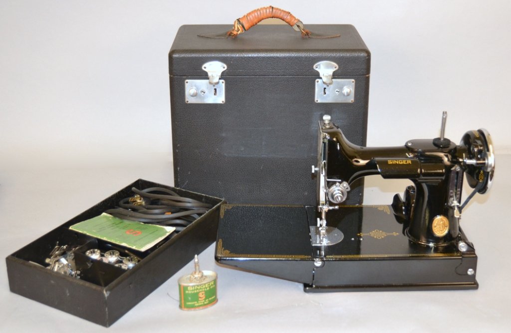 Singer Featherweight sewing machine in case: Singer Featherweight sewing machine in case, with foot pedal, five bobbins, attachments, instructions manual for Singer Portable Electric Sewing Machine 221-1, "Sewing Motor Catalog 3-110, 100-110 Vol