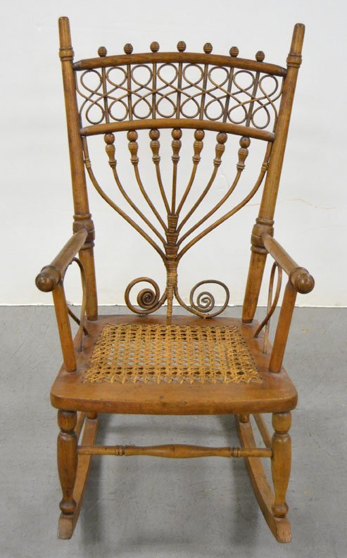 Heywood Bros. & Co. child's rocker: Heywood Bros. & Co. wicker and walnut child's rocker with cane seat, label on bottom, ca. 1900, 28 1/2" high x 14 1/2" x 21 1/2"