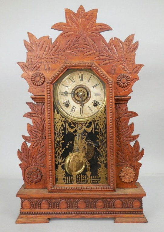 Gilbert oak cased kitchen shelf clock: Gilbert oak cased kitchen shelf clock "Laurel", with pendulum, Wm. L. Gilbert Clock Co. Winstead Conn. U.S.A., on back with hand written inscription, 24 1/4" high x 14 1/2", x 4 1/4"