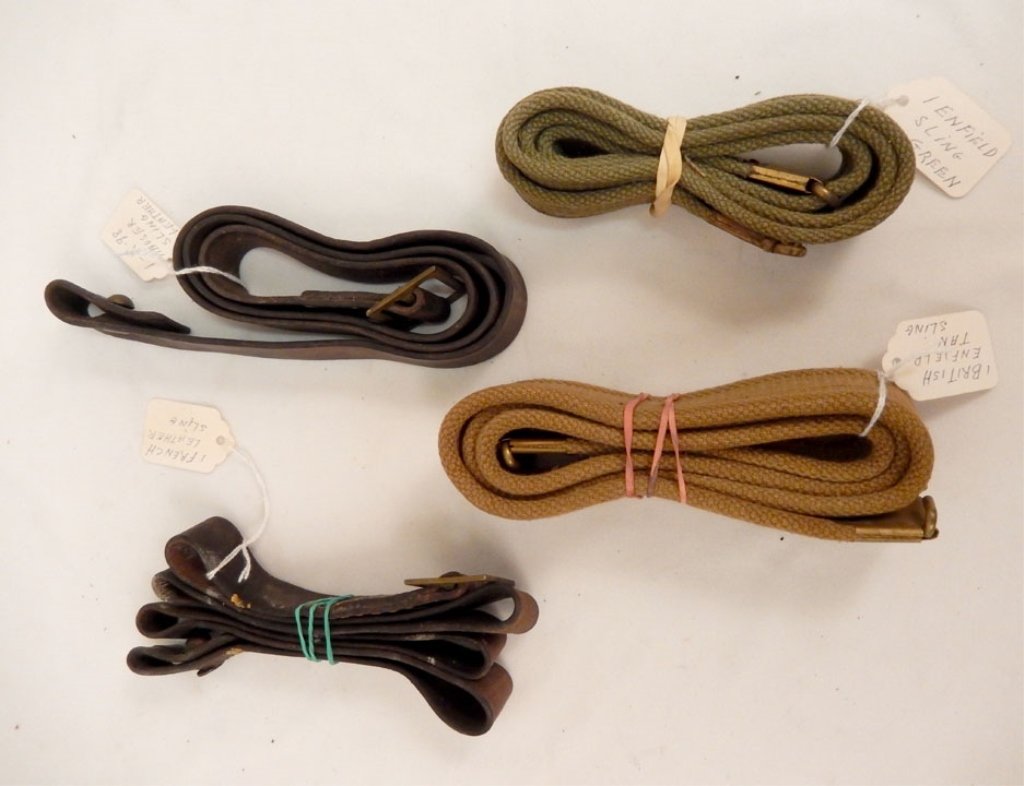 Four rifle slings: Four rifle slings, including K-98 Mauser leather sling, French leather sling, and two Enfield slings, one in green, one in tan
