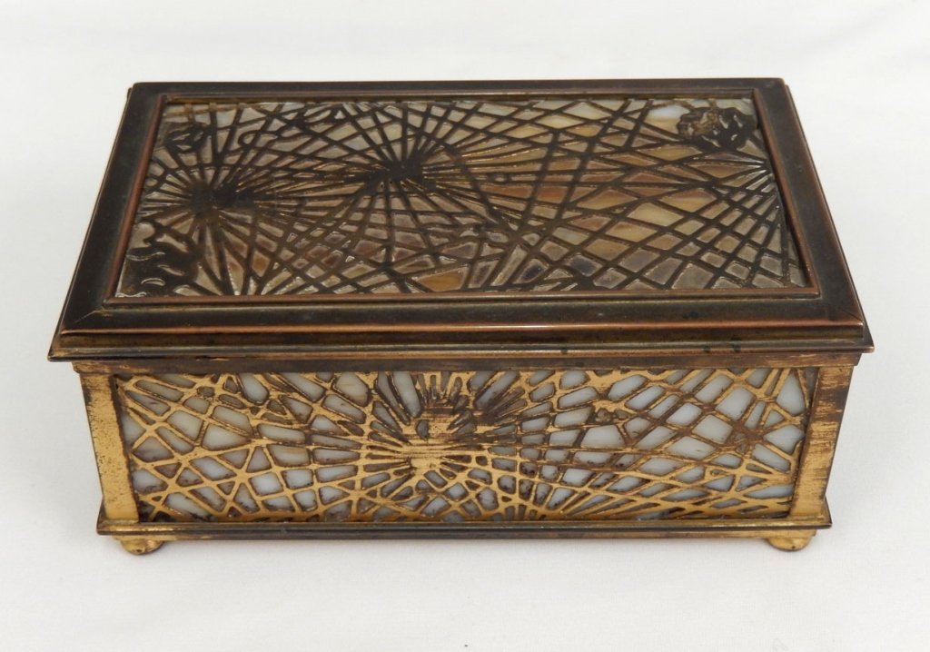Vintage Tiffany Studios jewelry box, Pine Needle design: Vintage Tiffany Studios jewelry box, pine needle design, gilt bronze and slag glass, marked on bottom Tiffany Studios New York 816, with two velvet lined trays, measures 3" x 6 1/2" x 3 3/4"