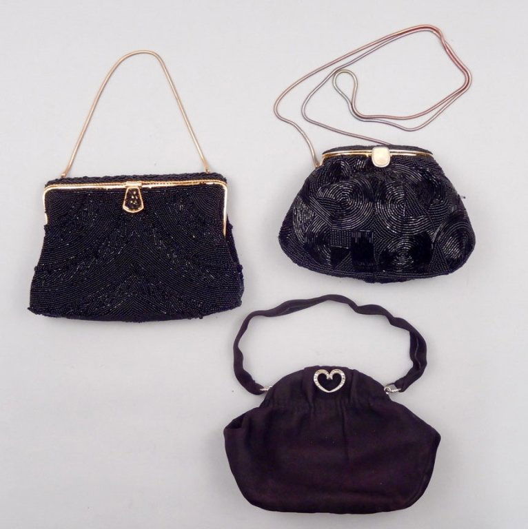 Three vintage purses: Three vintage purses including one soft suede, black with heart shaped marcasite clasp and trim on frame, 8" long x 6" high, tagged Leather School Florence, original box, one black bead purse 7 1/4" l