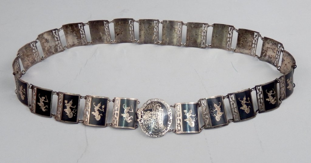 Siam silver niello belt: Siam silver niello belt with filigree decorated square panels, measures approximately 35" long x 1 1/2" wide, weighs 7.1 troy ounces, early 20th C.