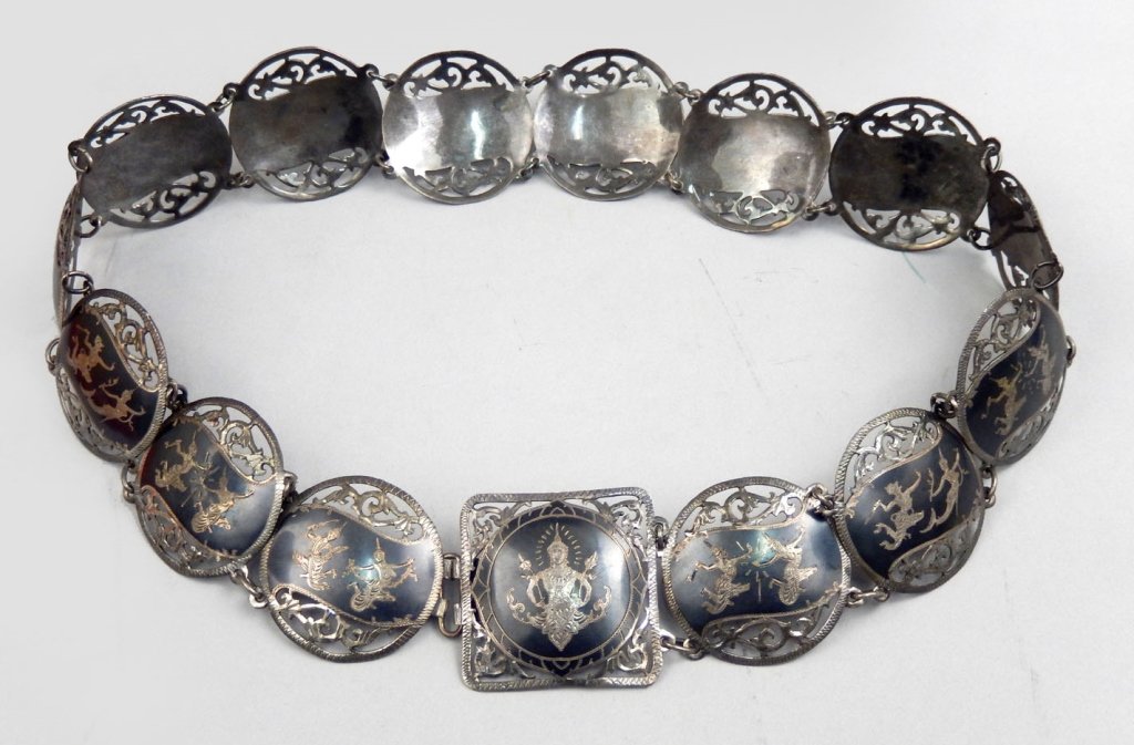 Siam silver niello belt: Siam silver niello belt with filigree decorated round panels, measures approximately 27" long x 1 5/8" wide, stamped Siam sterling, weighs 4.6 troy ounces, early 20th C.
