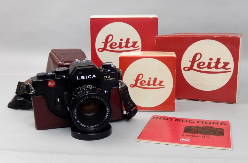 Leitz Leica R3 camera with case and manual: Leitz Leica R3 camera with case and instructions manual, Leica R3 Electronic camera, serial number 1475575, with Summicron-R 1:2 50MM lens with cover, camera in fitted leather case, marked Leica, impr