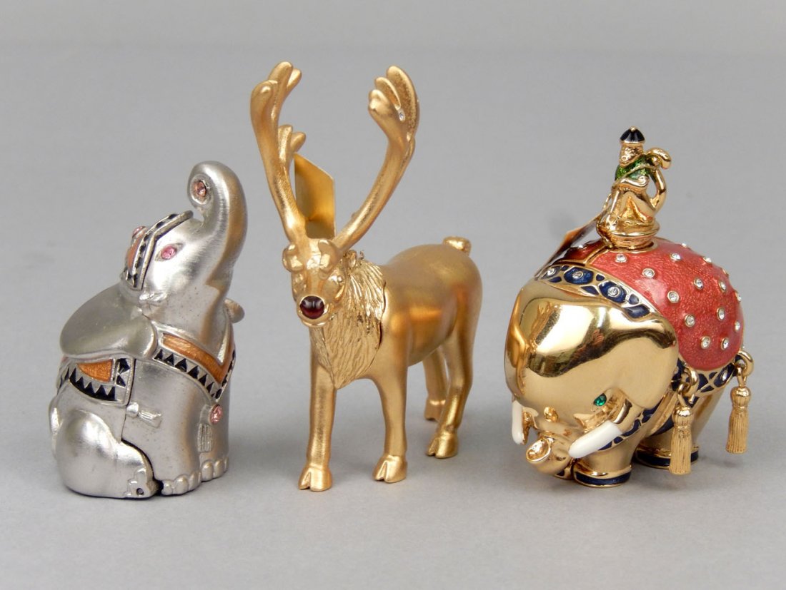 Three Estee Lauder solid perfume compacts: Three Estee Lauder solid perfume compacts including Beautiful 2005 "Bejeweled Elephant", Pleasures 2005 "Prancing Reindeer", and Pleasures 1998 "Lucky Elephant"