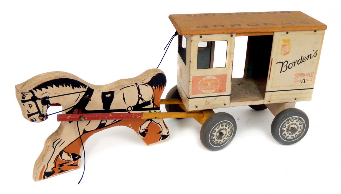 Rich Toys Borden's Milk Wagon: Rich Toys Borden's Milk Wagon, wooden roof has stenciled Borden's , tin litho delivery wagon, wooden horse, includes wooden milk bottle carrying case with one glass bottle, toy measures 18" long, Coll