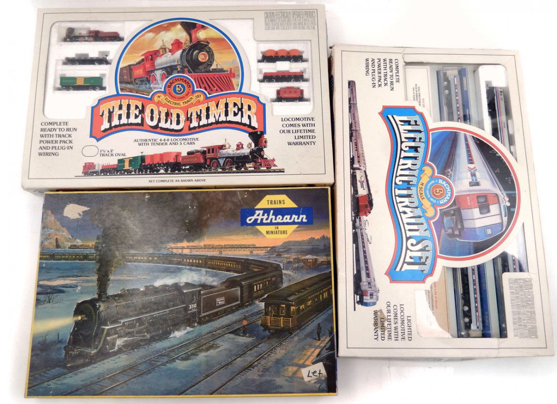 Three boxed train sets, N and HO scale,: Three boxed train sets, N and HO scale, includes Bachmann N scale The Old Timer set in box, missing track, Bachmann N scale Electric Train Set in box, Amtrak, complete, and Athearn HO scale Santa Fe t