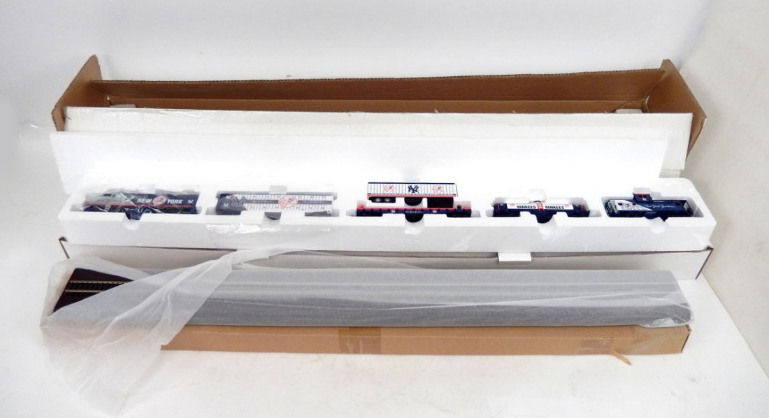 The Danbury Mint New York Yankees Train set in box,: The Danbury Mint New York Yankees Train set in box, includes locomotive with four freight cars, with wooden display board, box measures 5" x 40 1/2" x 7 1/2"