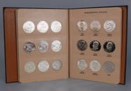 Book of thirty-two Eisenhower dollars 1971-1978 S