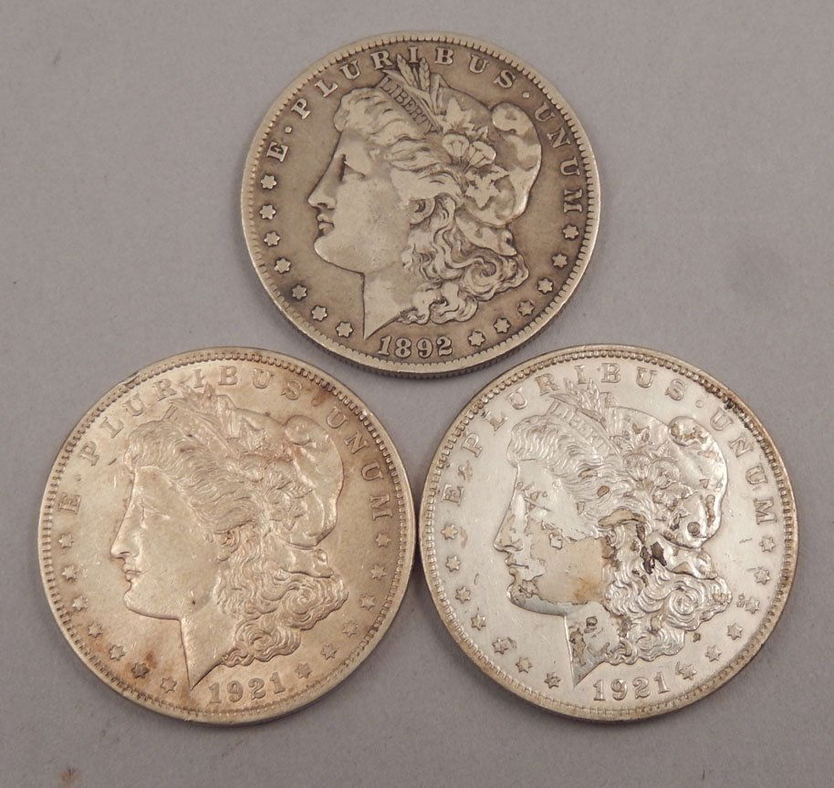 Three Morgan silver dollars, (1 of 2)