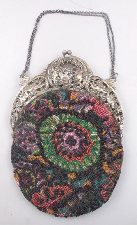Vintage micro beaded purse: Vintage micro beaded purse with an .800 silver, openwork frame, decorated with flowers, cherubs and swans, rolo chain strap, lined interior, measures approximately 10" x 7 1/4", stamped 800, early 20t