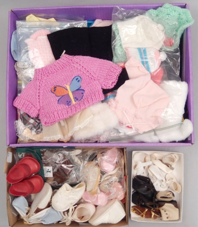 Grouping of doll clothes and shoes: Grouping of doll clothes and shoes, some vintage, some newer, various sizes Please be aware of shipping costs as we will not ship these items, and you will need to use a third party shipper. We recomm