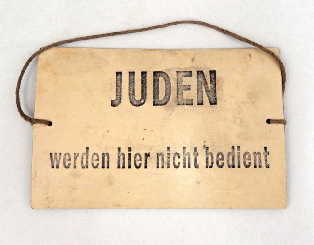 Anti-Semitic sign: Anti-Semitic sign, "Juden werden hier nicht bedient" (Jews are not served here), museum label on back, 4 3/4" x 7 3/8", post WWII sold at museum which has been closed since