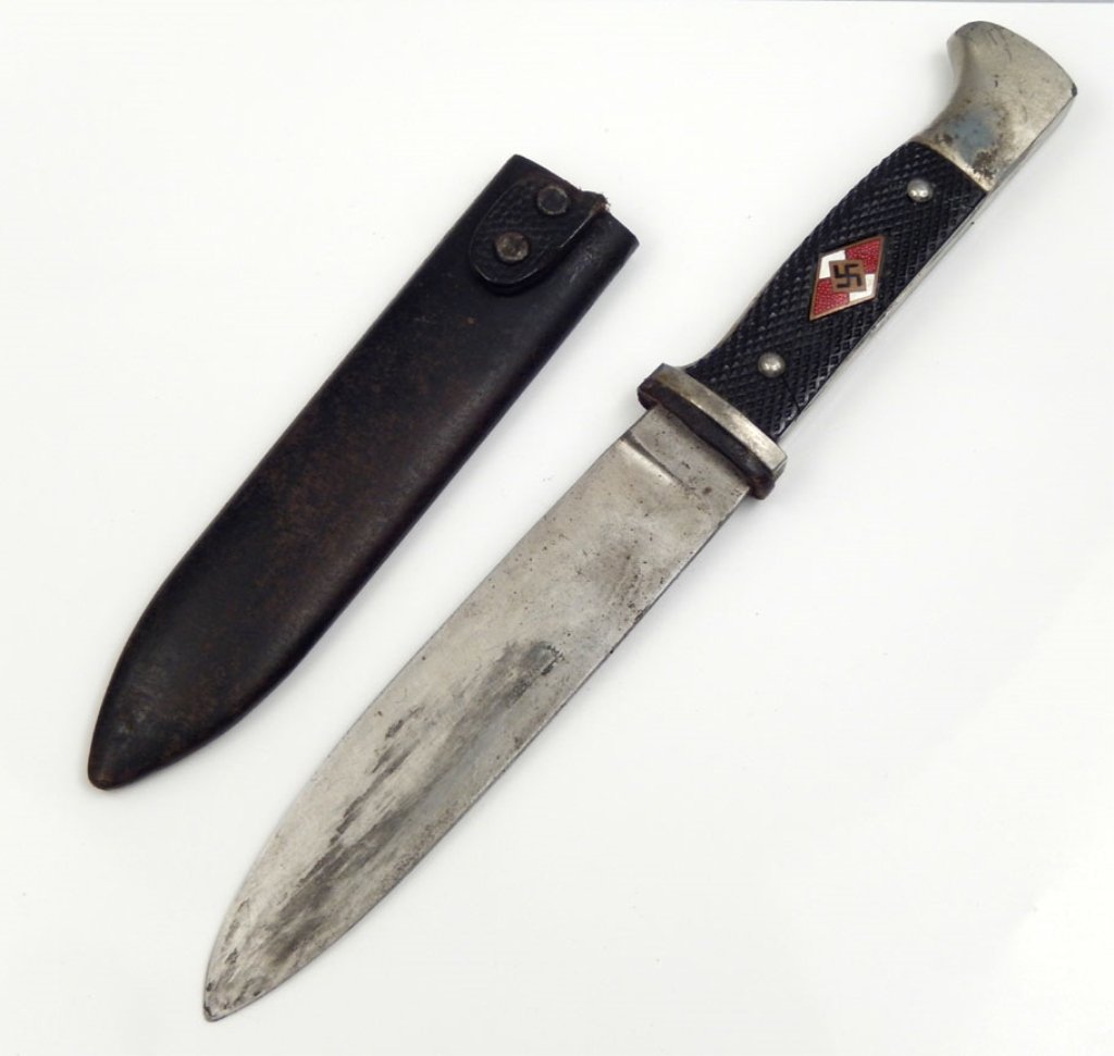 German Hitler Youth dagger in scabbard: German Hitler Youth dagger in scabbard, made into a boot knife (Edge of guard cut down) black plastic grip, red and white diamond with swatika in grip, blade marked RZM M7/8, blade 5 1/2", overall 10"