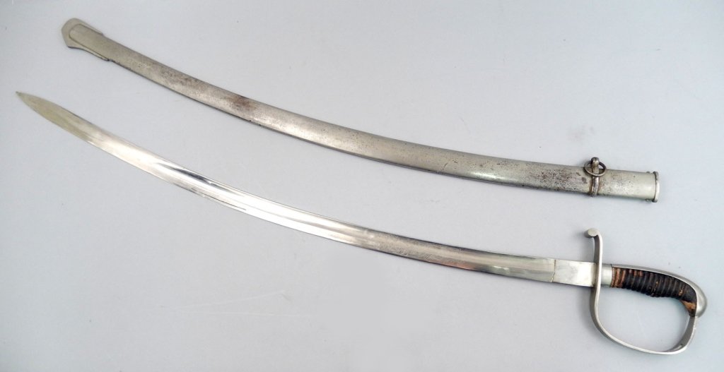 German Solingen cavalry saber in scabbard: German Solingen cavalry saber in scabbard, right ricasso stamped with makers mark CK Co, crown above two cross swords for Carl Kaiser, Solingen, leather grip, blade etched "In Treue fest", blade lengt