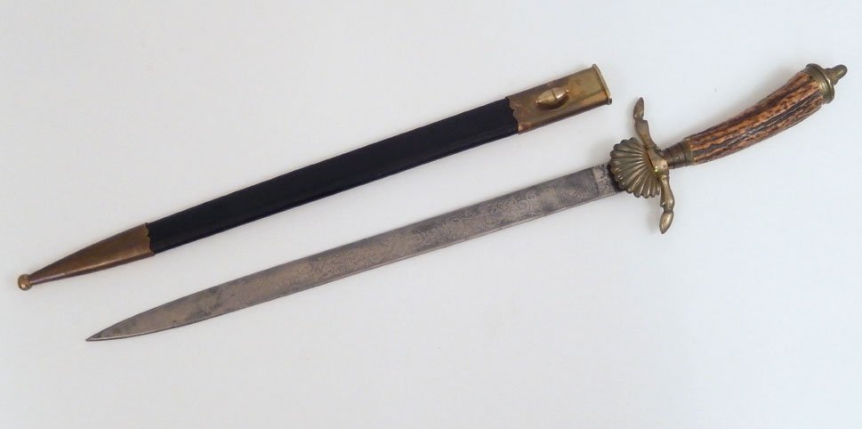 Antique German Forester dagger with scabbard, stag hand: Antique German Forester dagger with scabbard, stag handle, acorn finial on pommel, hoof feet ends of cross guard, engraved blade, blade length 14 7/8", overall length 21 3/4"