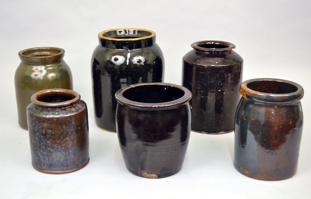 Grouping of stoneware crocks, jars, and a redware (1 of 4)