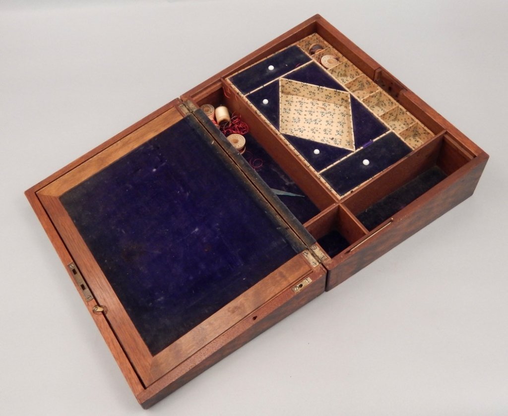 Mahogany sewing box with mother of pearl: Mahogany sewing box, applied mother of pearl on lid and escutcheon, lid corners have applied decoration (missing lower right corner), blue velvet lined interior, lift out tray, with some sewing conten