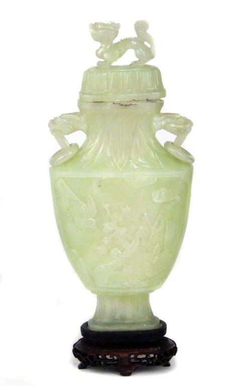 Chinese jade urn with lid: Chinese jade urn with lid, foo dragon finial, carved bird decoration, lions head handles with rings, fitted wooden stand, urn 8 3/4" x 4", stand 1 1/4"