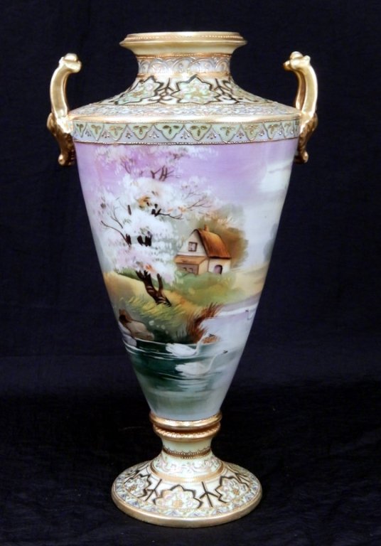 Nippon hand painted vase: Nippon hand painted vase, depicting scene with cottage and swans on lake, gilt decoration, animal head double handles, green mark on bottom, 14 3/8" high