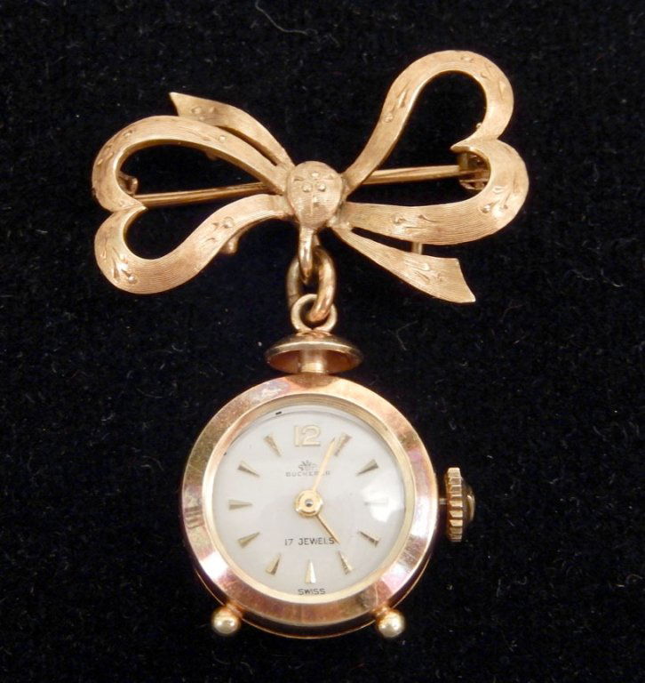 Bucherer 18k gold watch pin: Bucherer 18k gold watch pin, Swiss movement, 17 jewels, case measures approximately 17mm across, stamped CB 750, weighs 11.1 gr/7.1 dwt complete, mid 20th C