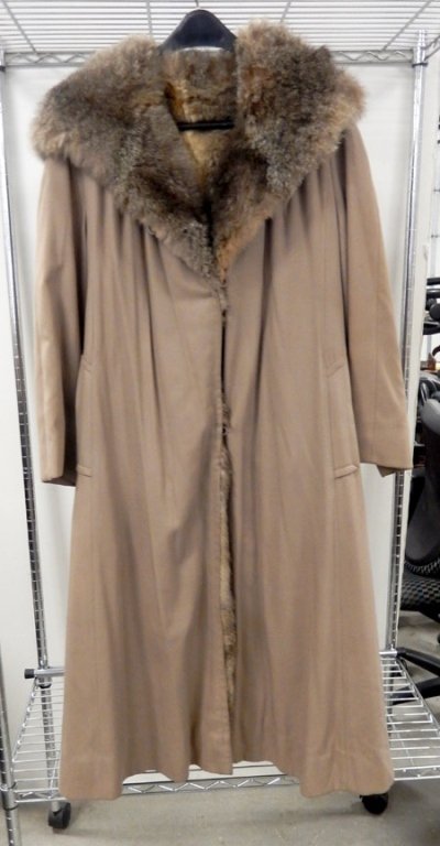 Fur lined raincoat: Fur lined raincoat, with hood, shoulder to shoulder 20", shoulder to cuff 22", and collar to bottom 47"
