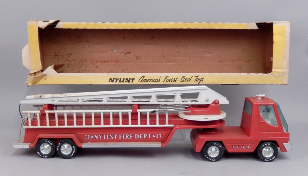 Nylint Aerial Ladder Fire Truck No. 1210 in original: Nylint Aerial Ladder Fire Truck No. 1210 in original box, pressed steel truck, box measures 31 1/2" x 7 3/4" x 6"
